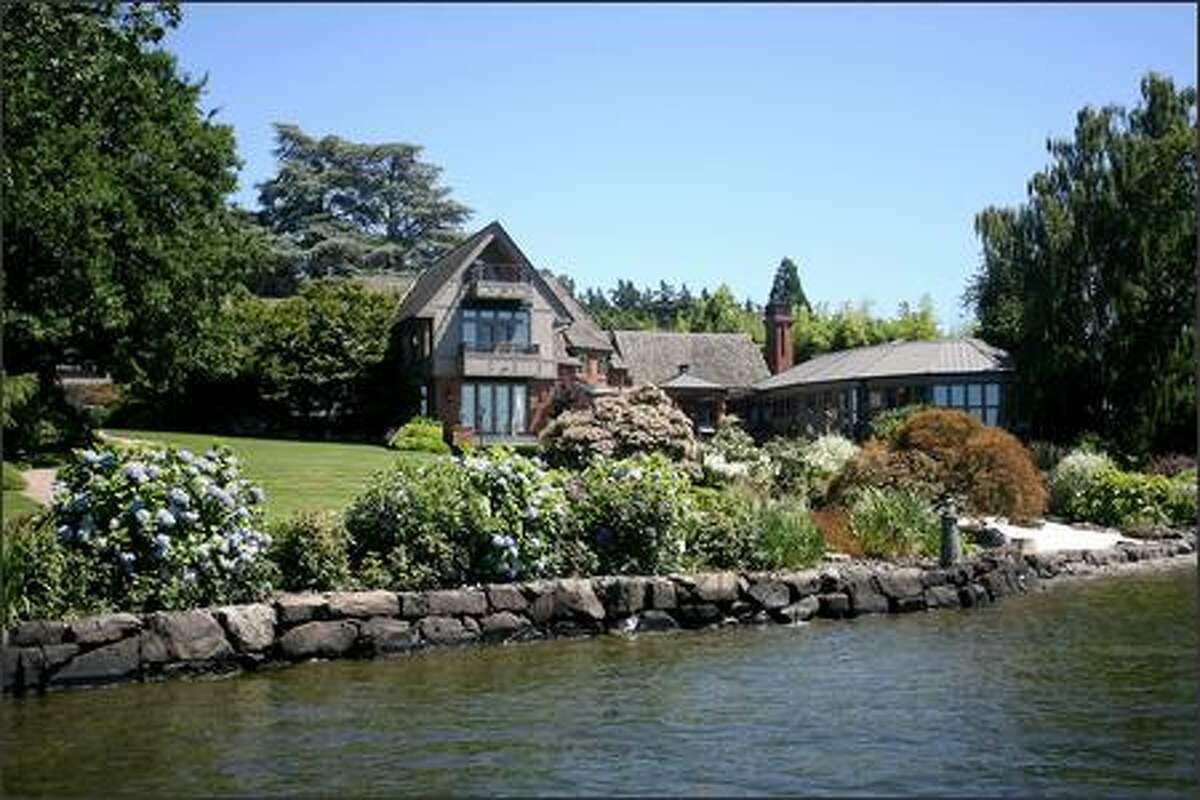 A view from the dock shows the Lake Washington-facing side of the Mercer Island home.
