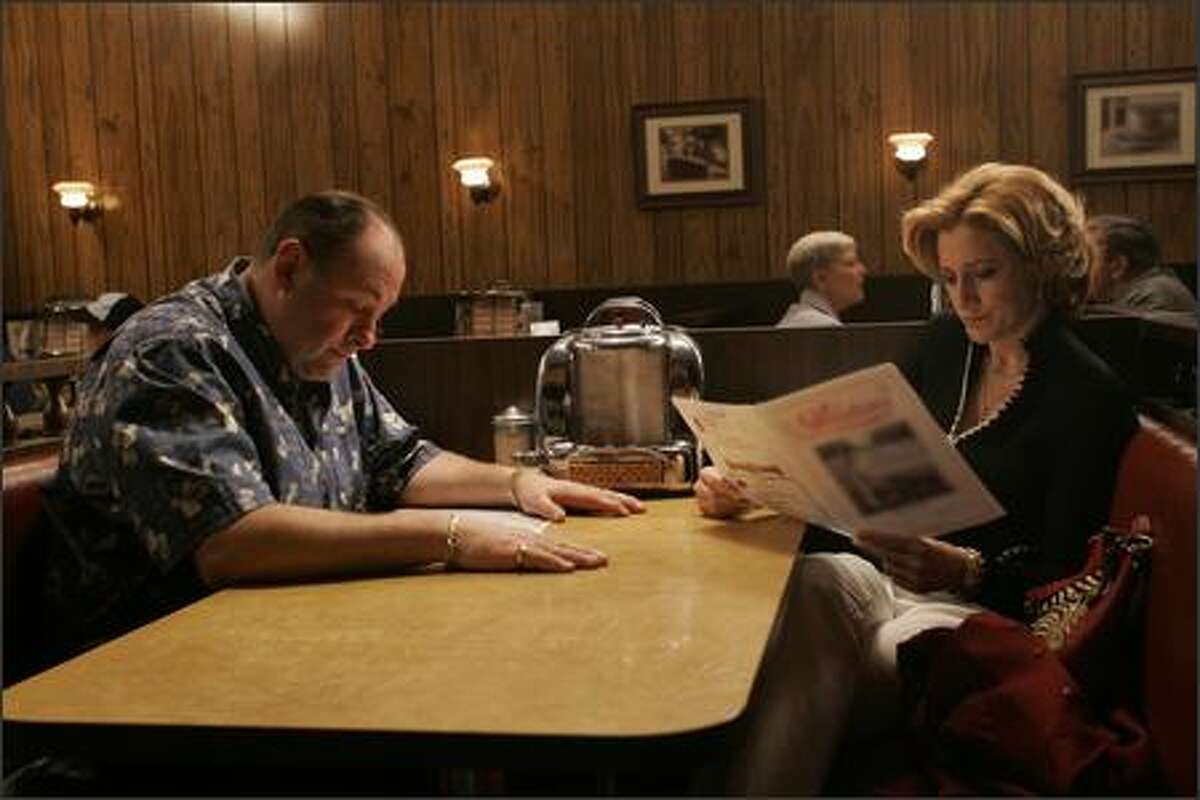 "The gang shows up for family dinner" James Gandolfini (Tony Soprano) Edie Falco (Carmela) Robert Iler (Anthony Jr.) on The Sopranos.