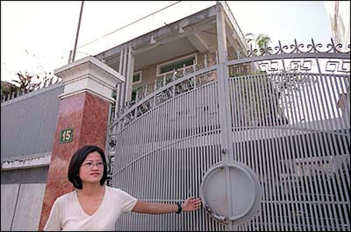 When the Communists North Vietnamese overthrew the government of South Vietnam in 1975 they seized homes and property, including the Le family home in Ho Chi Minh City. After a brief, tense visit with the new owners, Phuong Le closes the gate.