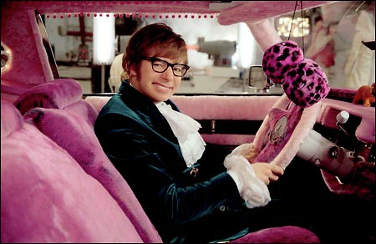 Austin Powers (Mike Myers) behind the wheel of his time-traveling 'Pimpmobile.'