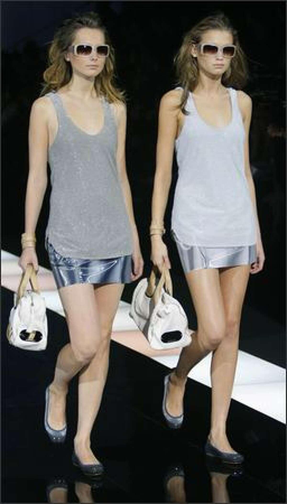 Model present creations by Italian designer Giorgio Armani for Emporio Armani during the Spring/Summer 2008 collections of the Milan ready-to-wear fashion shows.