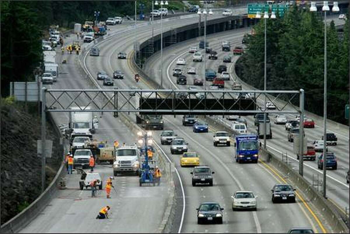 Northbound traffic, reduced to three lanes, travels without incident past the I-5 construction zone on Monday morning as viewed from the Holgate overpass.