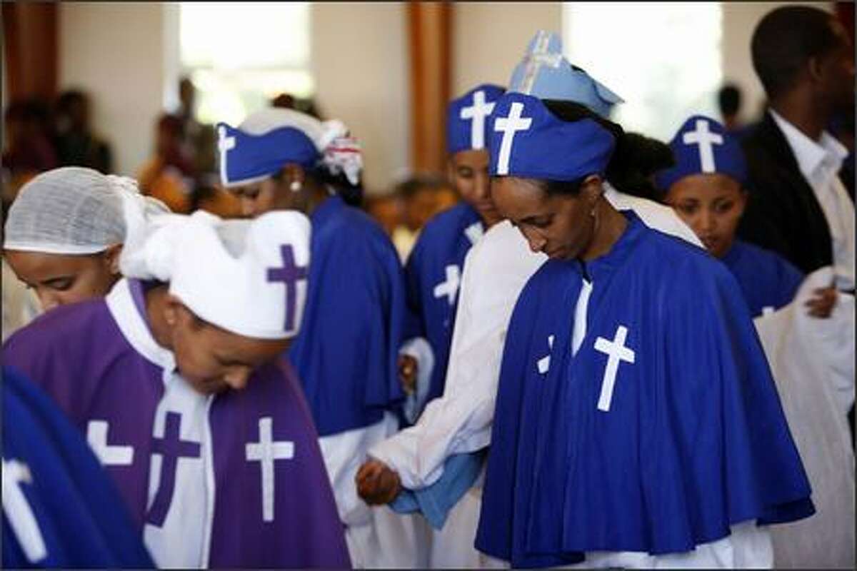 The church choir takes their seats at St. Gebriel Church in Seattle on September 9, 2007, the Sunday before the millennium. Ethiopians all over the world will celebrate the new millennium on September 12, 2007 (Meskerem 1, 2000 Ethiopian calendar).
