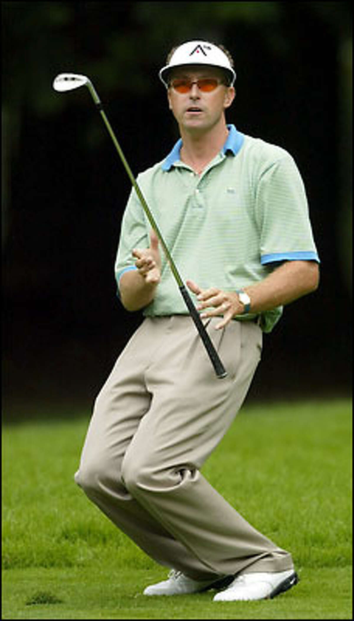 Robert Allenby from Austrralia reacts to a poor second shot on No. 11.