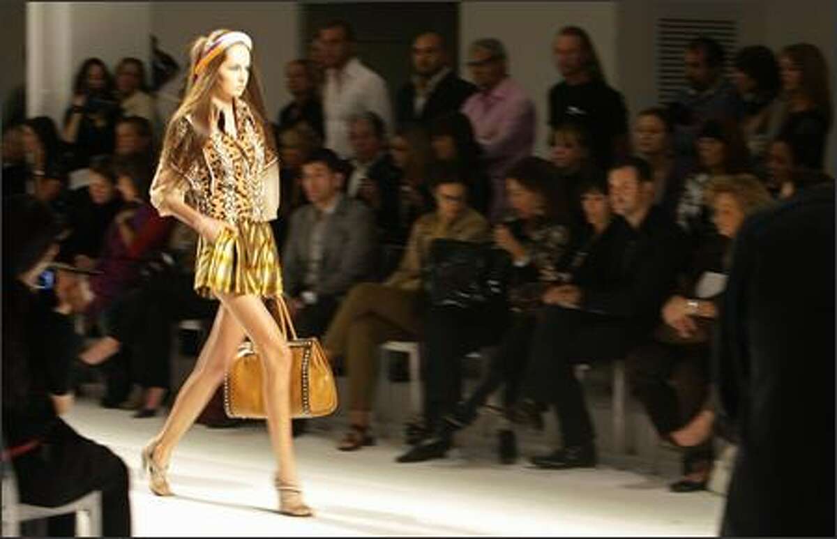 A model presents a creation by Rifat Ozbek for Pollini.