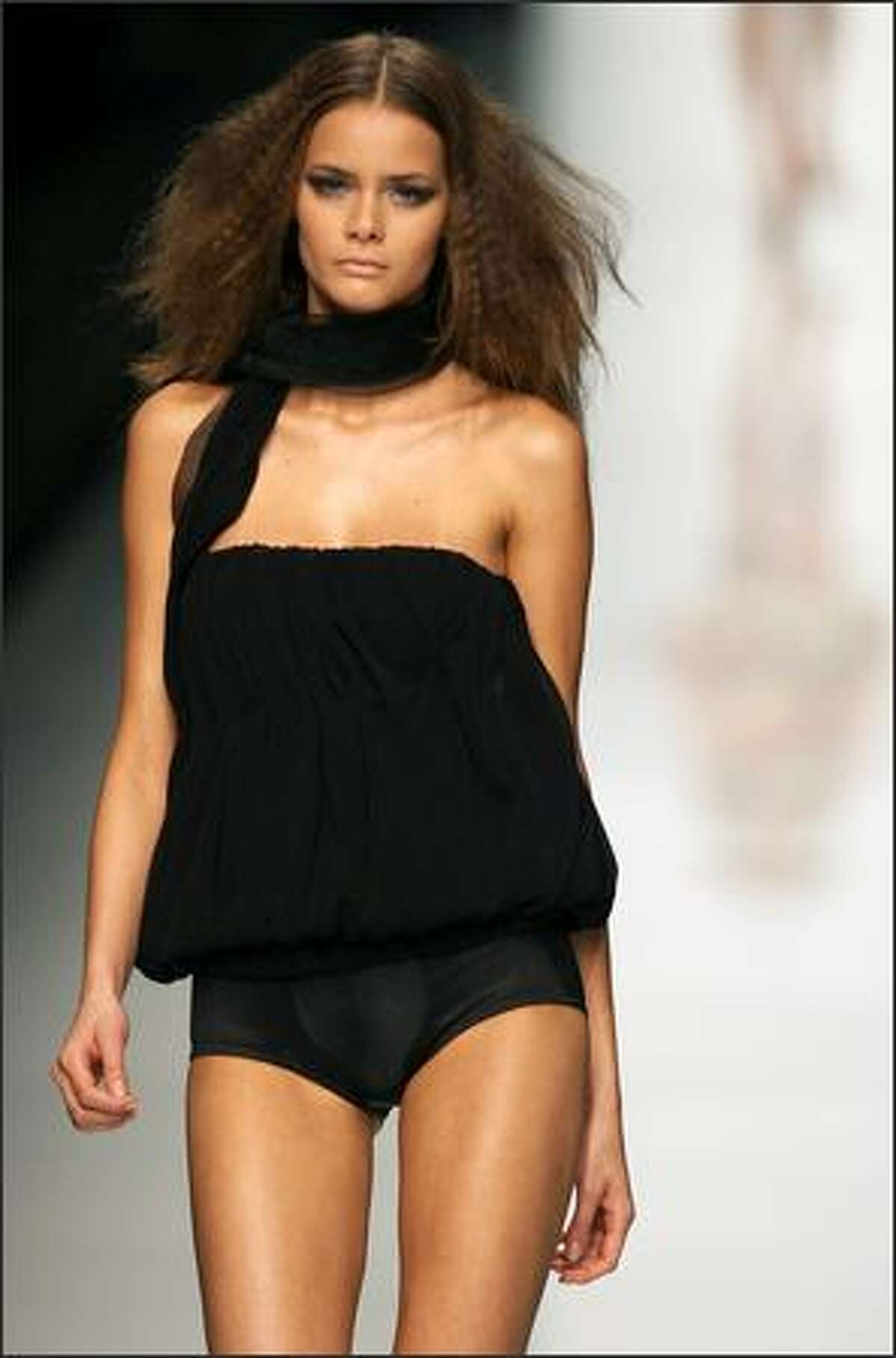 A model presents a creation by Love Sex Money during the spring/summer 2008 collections of the Milan ready-to-wear fashion shows.