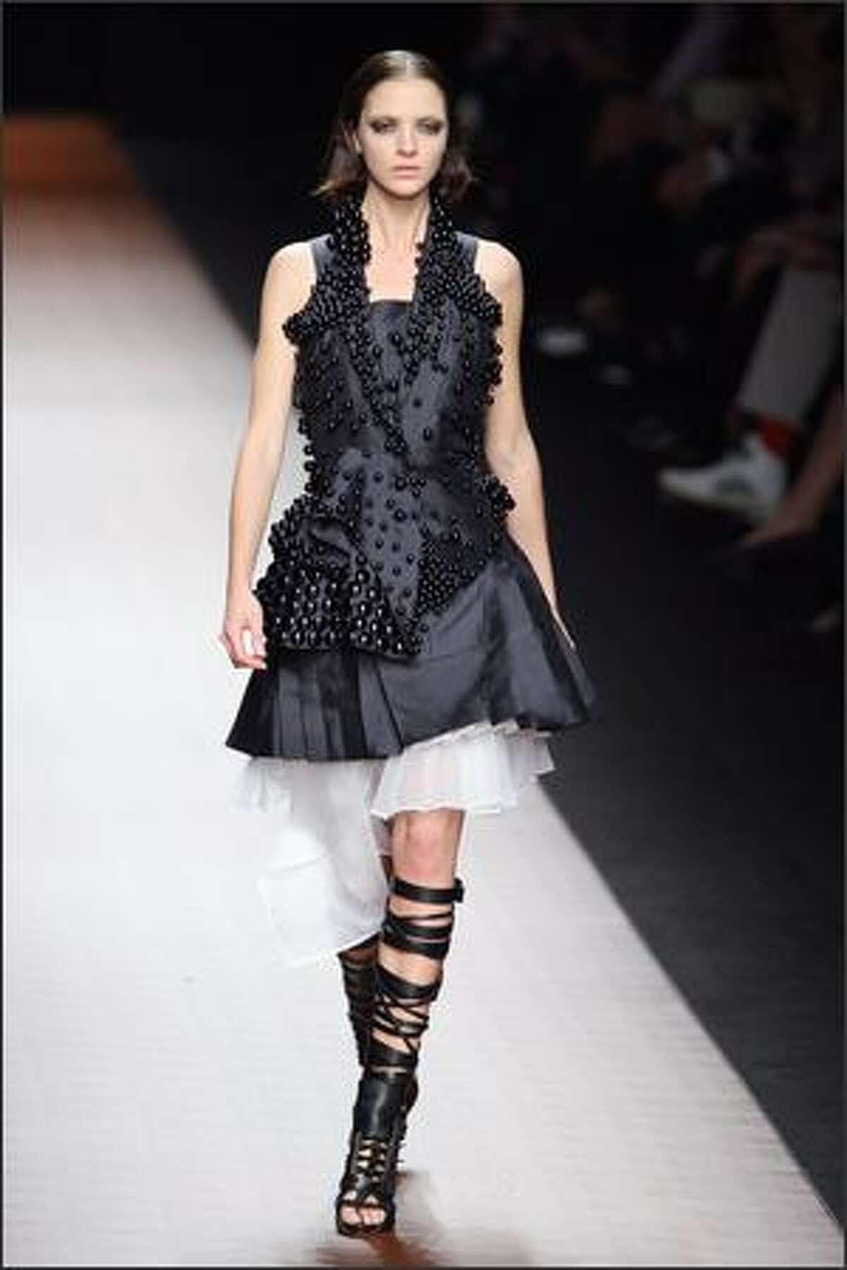 Italian model Maria Carla Boscono presents a creation by Ricardo Tisci for Givenchy.