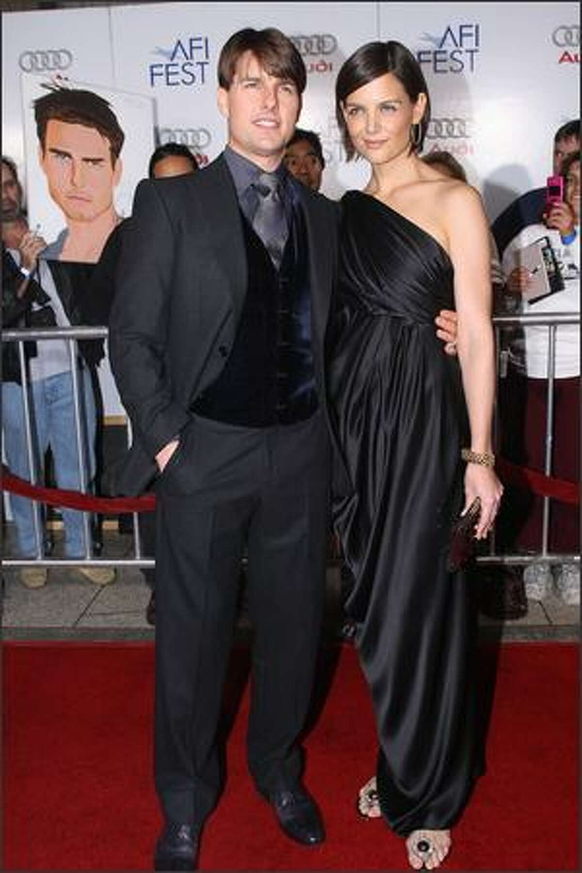 Cast member Tom Cruise and his wife Katie Holmes arrive for the AFI FEST 2007 opening night gala premiere of "Lions For Lambs" at the Arclight Cinerama Dome in Hollywood, Calif.