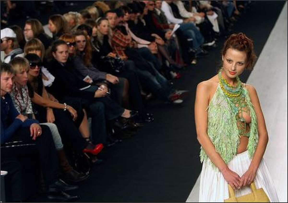 A model displays an outfit from the ready-to-wear collection by popular Ukrainian fashion designer Oksana Karavanska during the opening of Ukrainian Fashion Week 11 October 2007 in Kiev.