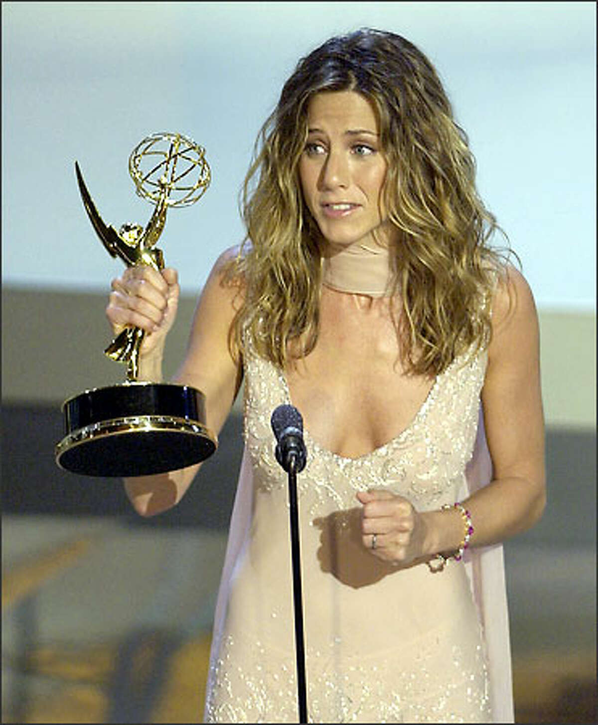 Jennifer Aniston accepts her Emmy for outstanding lead actress in a comedy series for her work in "Friends." The show also won for comedy series.