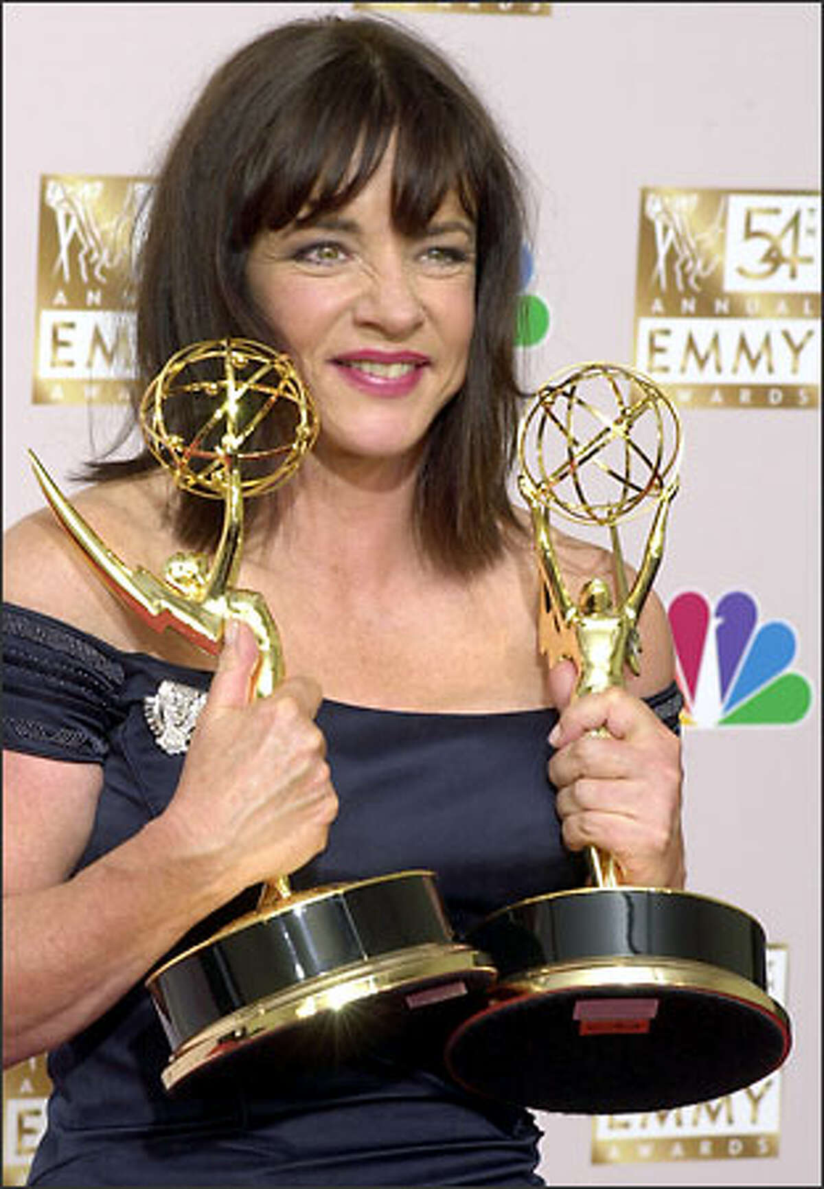 Stockard Channing displays the two Emmys she won last night. Channing won for roles in "The West Wing" and "The Matthew Shepard Story."