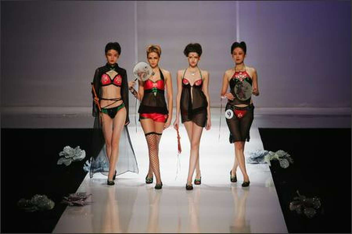Models walk the runway during "Ordifen Cup" 2007 Lingerie Innovative Design Contest at the China International Fashion Week Spring/Summer 2008 on November 6, 2007 in Beijing, China.