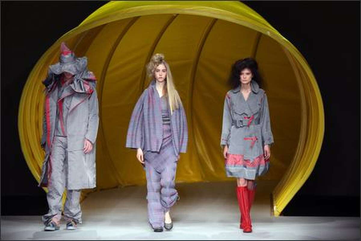 Models present creations by Dai Fujiwara for Issey Miyake during the Spring/Summer 2008 ready-to-wear collection show in Paris.
