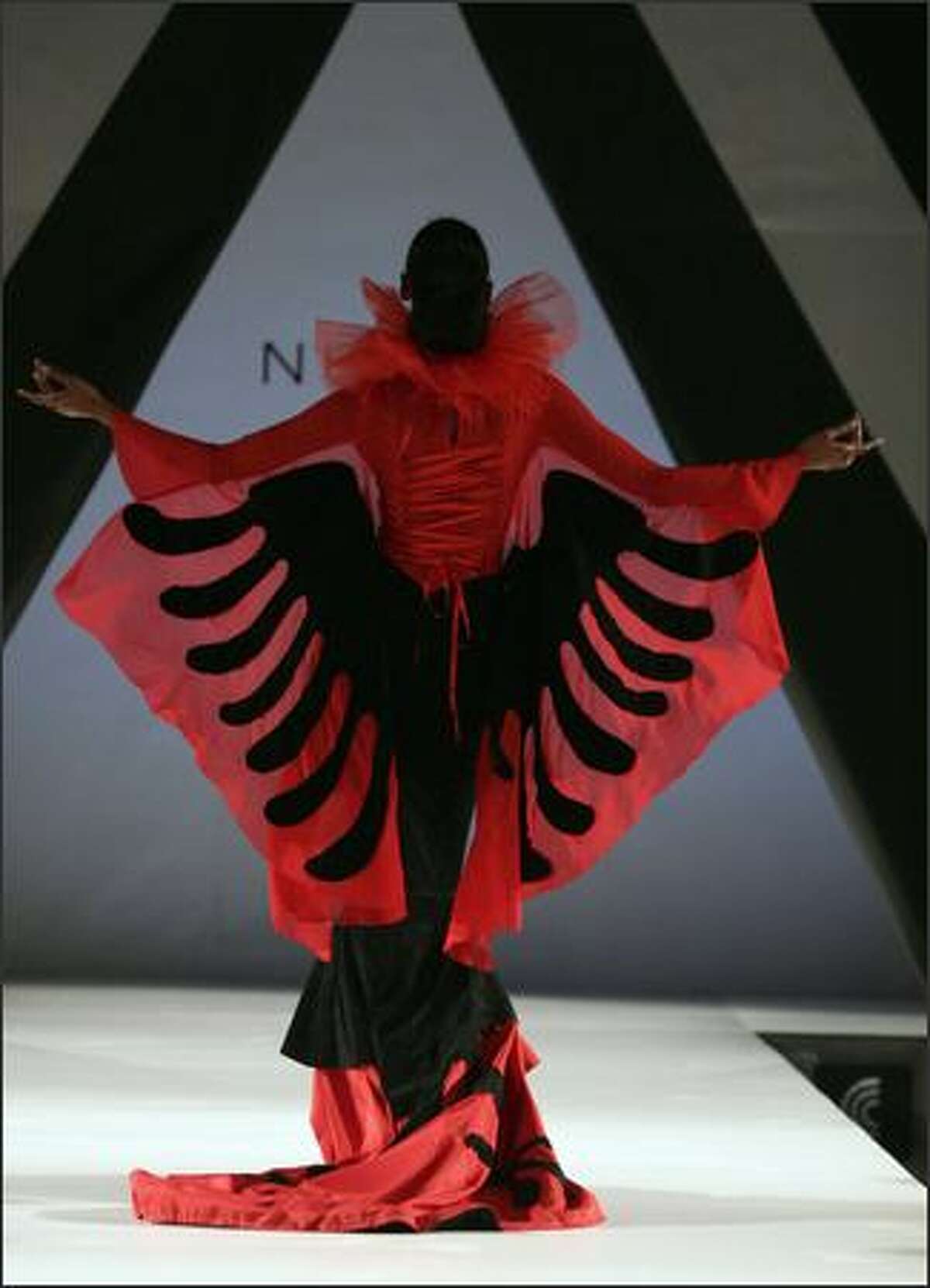 A model wearing a creation of Albanian designer Mirela Nurce walks the catwalk during the first day of 'Tirana Fashion Week' in Tirana, 25 October 2007. Creators from Albania, Kosovo, Macedonia and Greece will take part during this fashion week event.