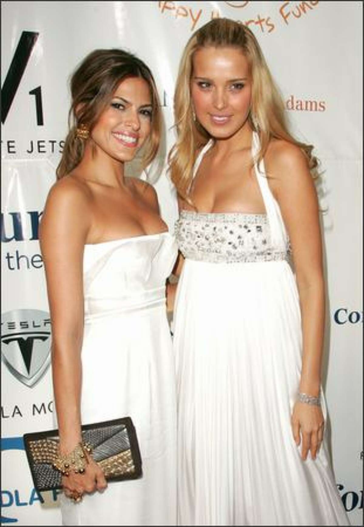 Actress Eva Mendes and model Petra Nemcova attend the "Heart Of Gold Ball" to benefit The Happy Hearts Fund at Cipriani's Wall street location on October 10, 2007 in New York City.