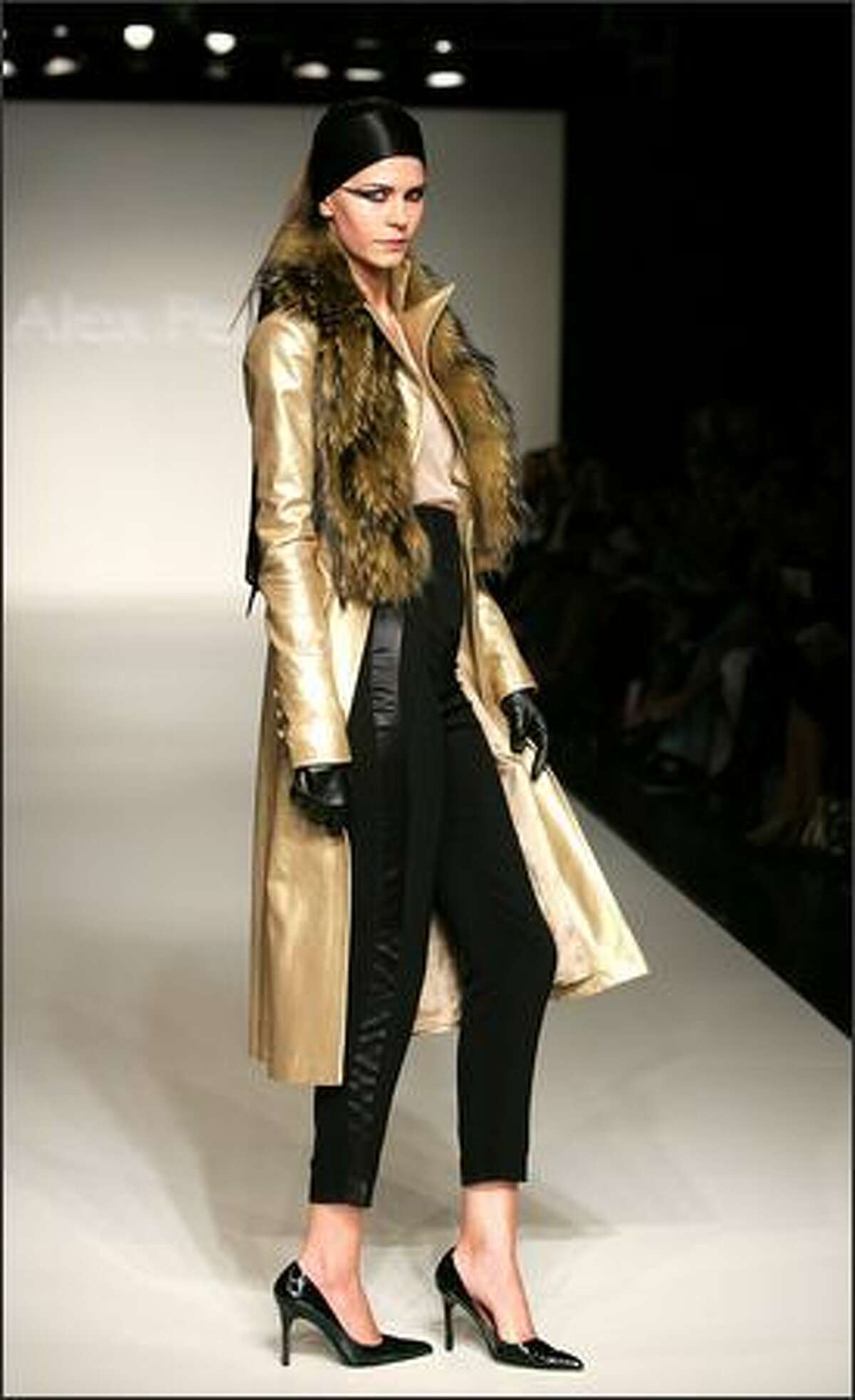 A model showcases designs on the catwalk by Alex Perry on the first day of Rosemount Australian Fashion Week's Transeasonal 2008 Collections, at the Overseas Passenger Terminal on October 9, 2007 in Sydney, Australia.