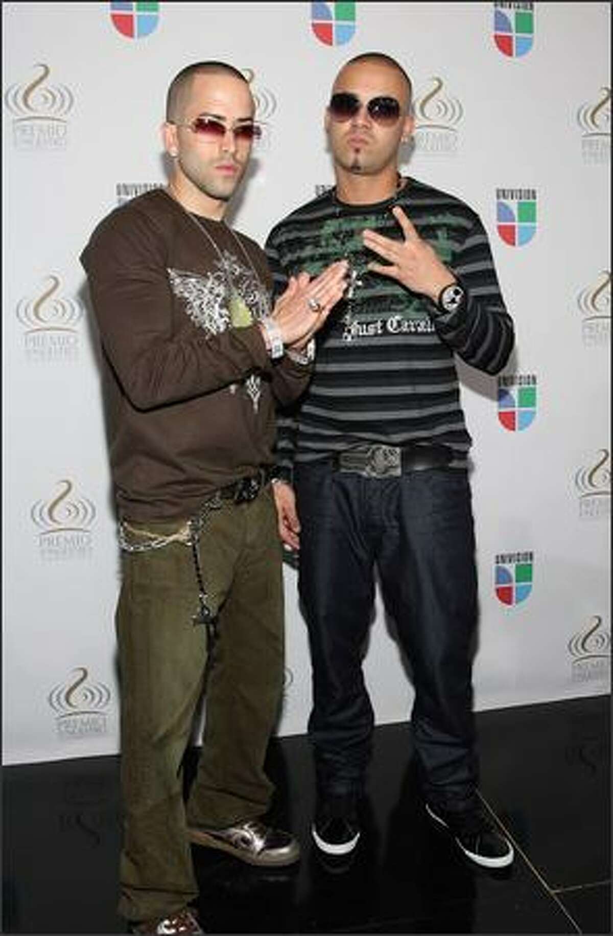 Recording artists Yandel and Wisin pose at Bongos Cuban Cafe during a press conference to announce the nominees for the 2008 Premio lo Nuestro a la Musica Latina awards show at the Bongos Cuban Cafe on December 12, 2007 in Miami, Florida.