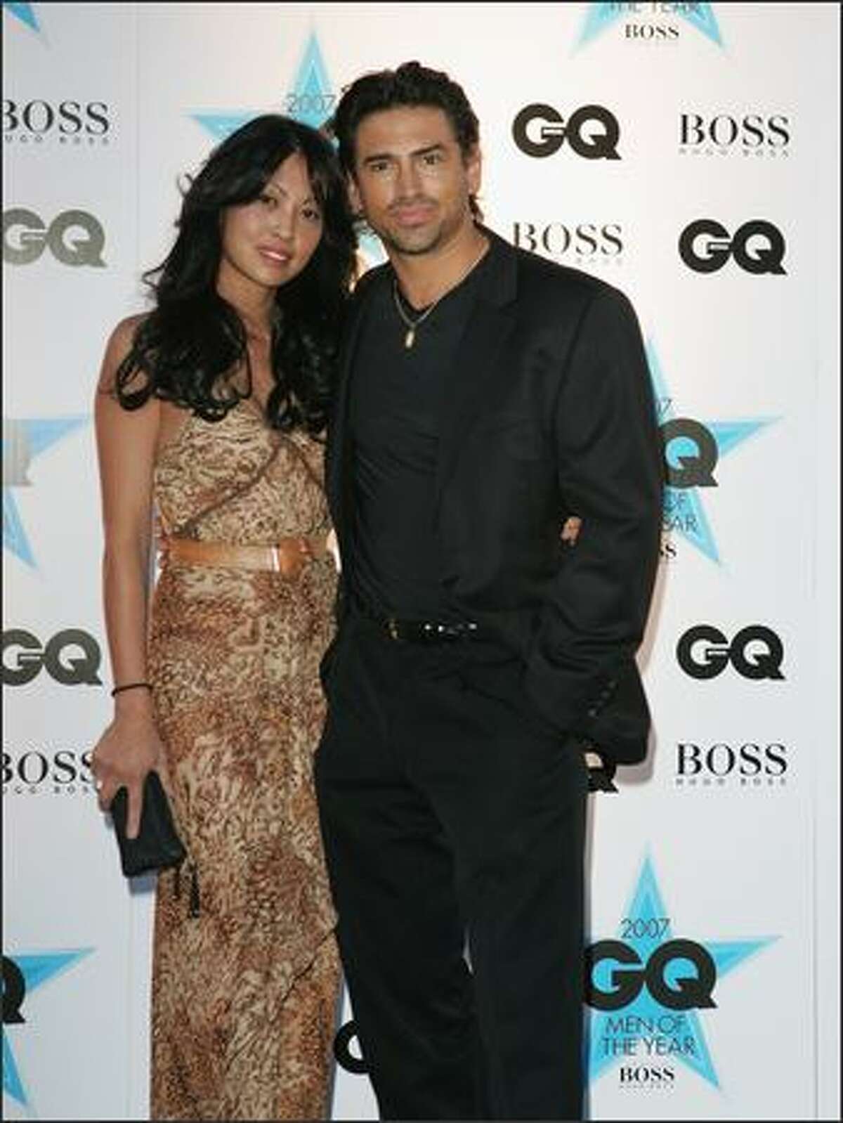 Cherri Tione and Justin Melvey attend the GQ Men of the Year Awards at Fox Studios on Tuesday in Sydney, Australia.
