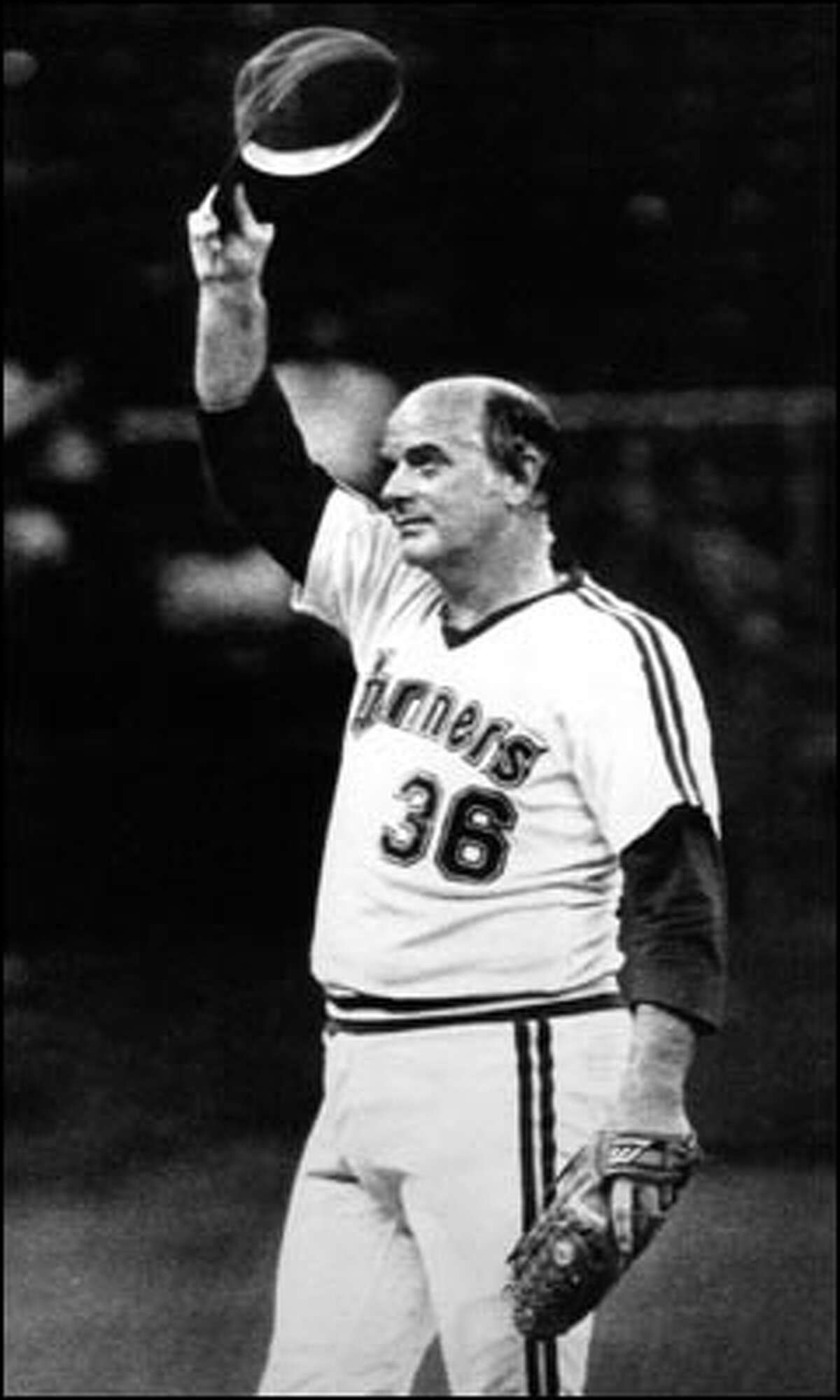August 1982: Seattle Mariners pitcher Gaylord Perry tips his hat after throwing his 100th strikeout of the year.