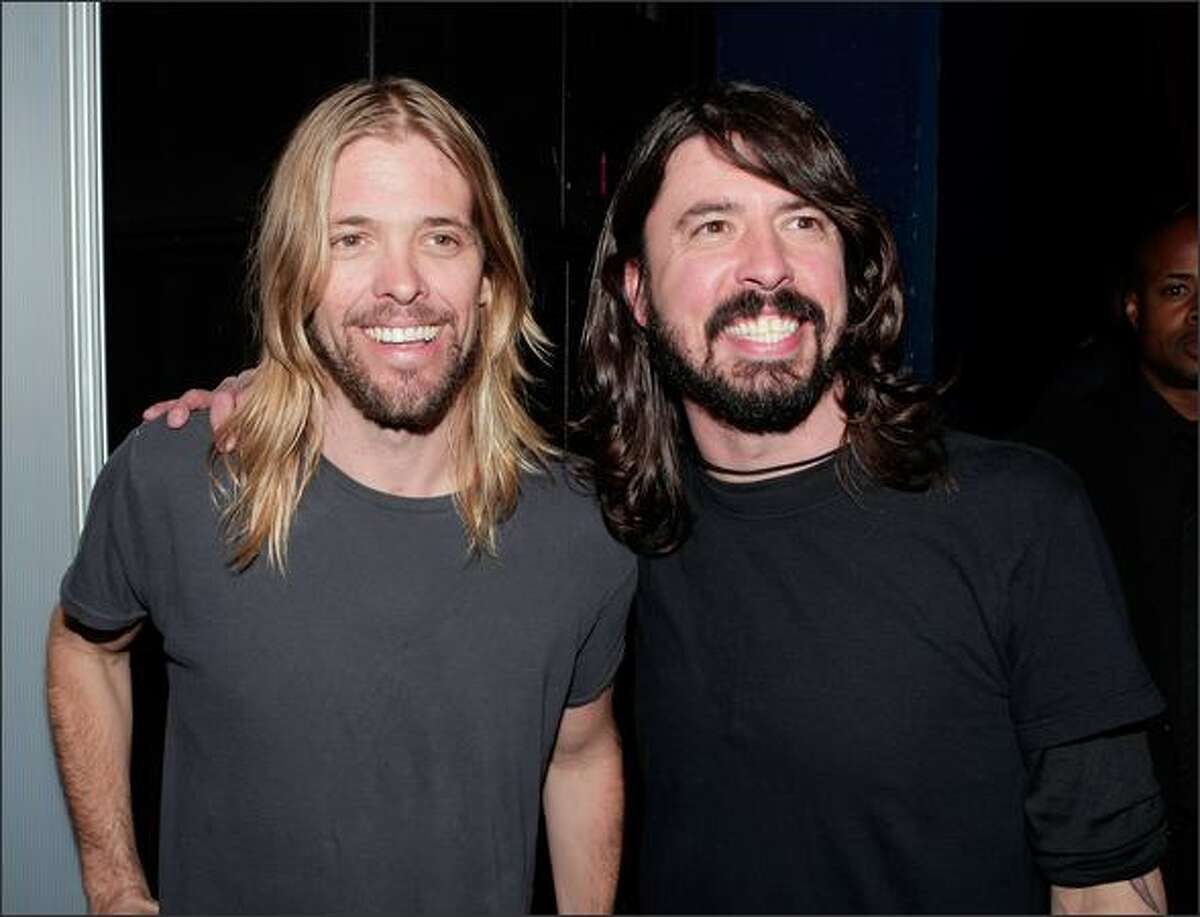 Musicians Taylor Hawkins (L) and Dave Grohl of the "Foo Fighters" pose after the 50th annual Grammy Award Nominations held at the Henry Fonda Music Box Theatre on Tuesday in Hollywood, Calif. The 50th annual Grammy Awards will air live on CBS February 10, 2008.
