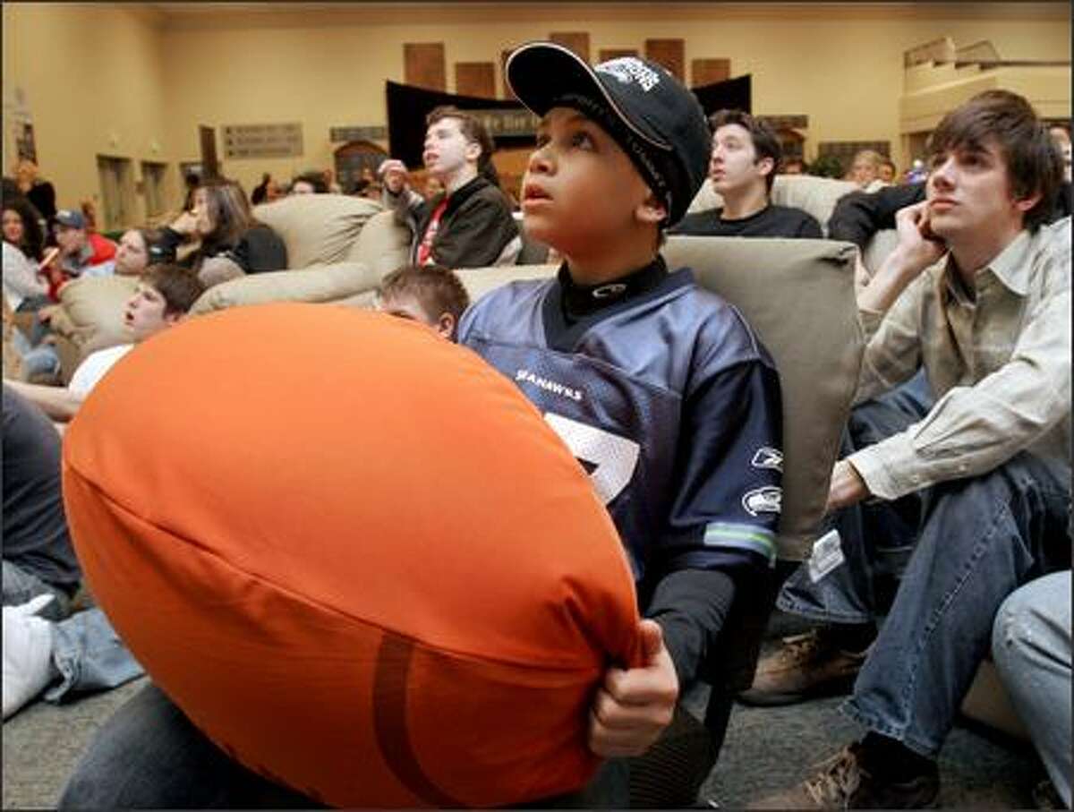 Marquel Ruffin, 9, watches the Super Bowl on a large screen at SeaTac's Christian Faith Church, which Seattle Seahawk Shaun Alexander attends when he's in town.