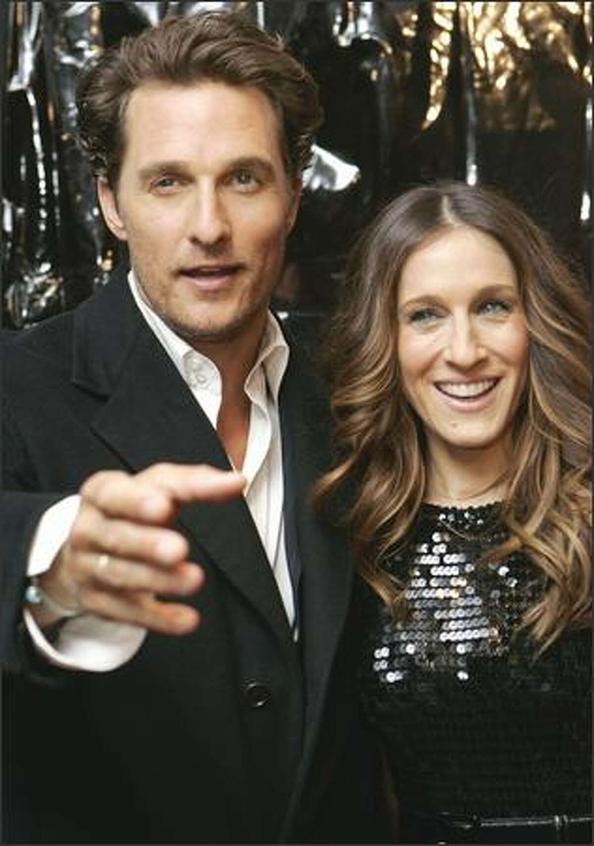 Matthew McConnaughey and Sarah Jessica Parker mug for the cameras at the premiere of their movie, "Failure To Launch," in New York Wednesday. The film's director, Tom Dey, says McConnaughey and Parker are totally different people and it was fun to watch his laid-back style with her high-energy persona.