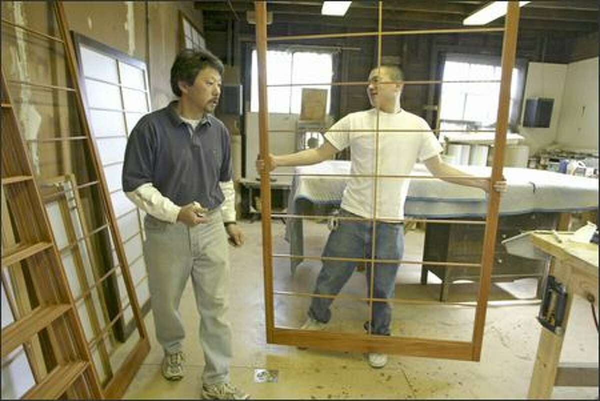 Mike Fujii and son Matt work at Bush Woodcraft in Seattle, one of the few West Coast shops that make Japanese shoji screens.