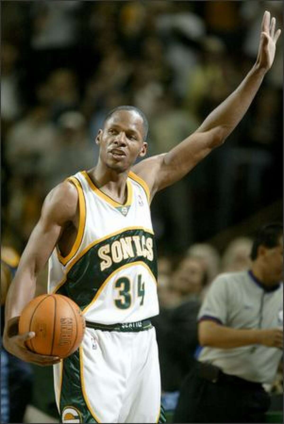 Ray Allen acknowledges the crowd after making his 268th 3-point basket of the season to break the NBA record set by Orlando's Dennis Scott in 1995-96.