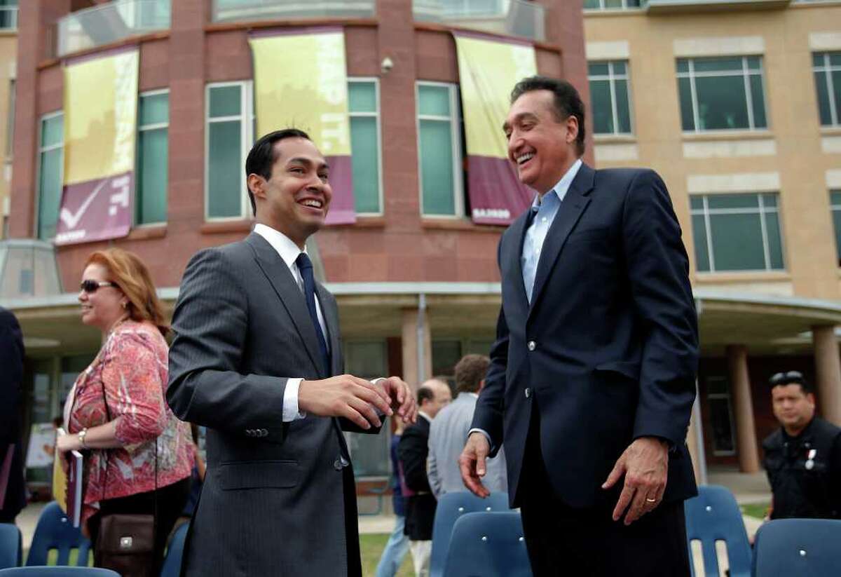 Mayor Julian Castro (left) shares a celebratory moment with former mayer Henry Cisneros after announcing the first series of projects to come from SA2020 at the UTSA downtown campus on Saturday, Mar. 19, 2011. Castro credited Cisneros' efforts for the Target '90 project which its mission was similar to the current SA2020 campaign. Kin Man Hui/kmhui@express-news.net