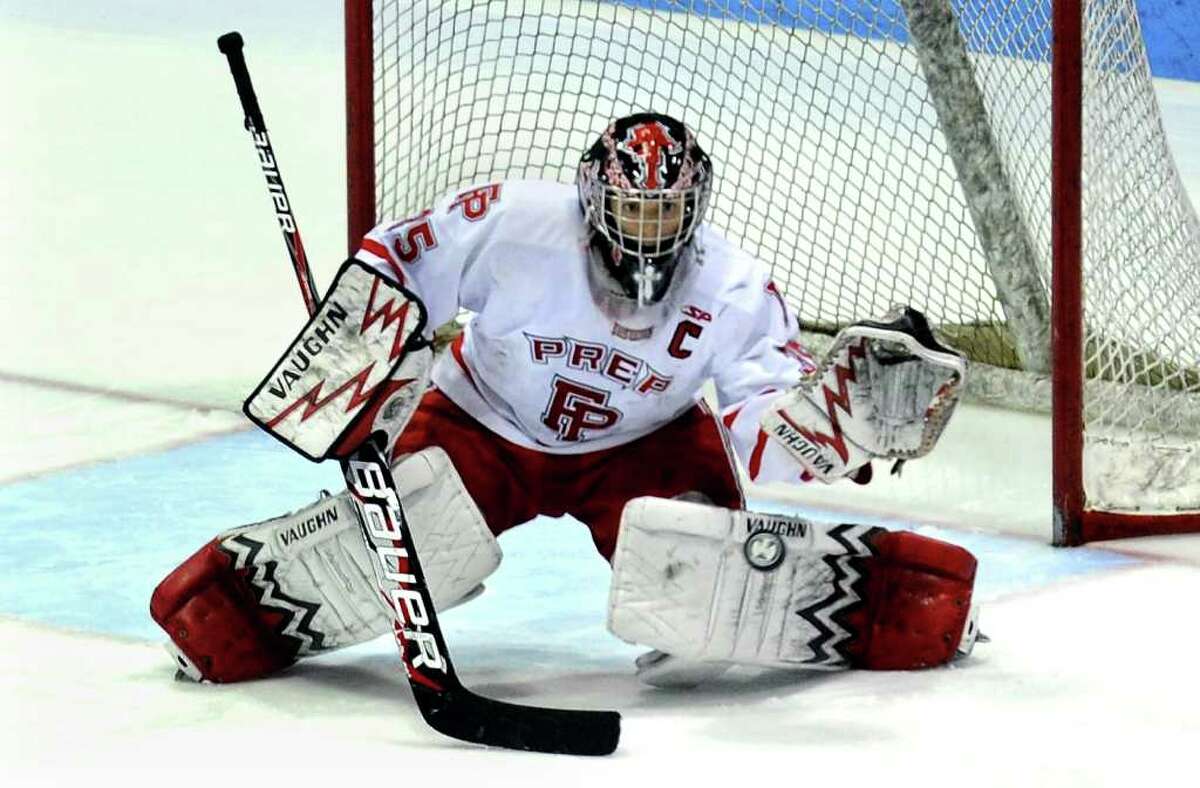 Fairfield Prep goalie John Galiani prepares to stop a St. Joseph goal attempt, during the state final of CIAC boys hockey at Yale's Ingalis Rink in New Haven, Conn. on March 19, 2011.
