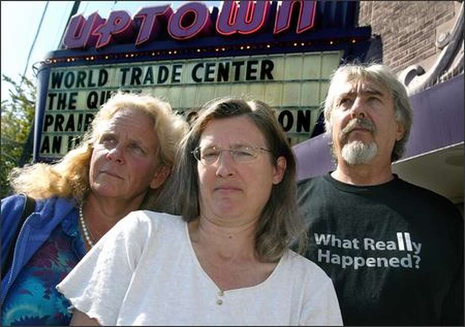 Kim Kerrigan, left, Connie Eichenlaub, center, and Ben Collet are members of the 911 Visibility Project. The Seattle-based group believes the government played a role in the Sept. 11 attacks, and they'll be on the streets today trying to share their message with others. Photo: Gilbert W. Arias/Seattle Post-Intelligencer