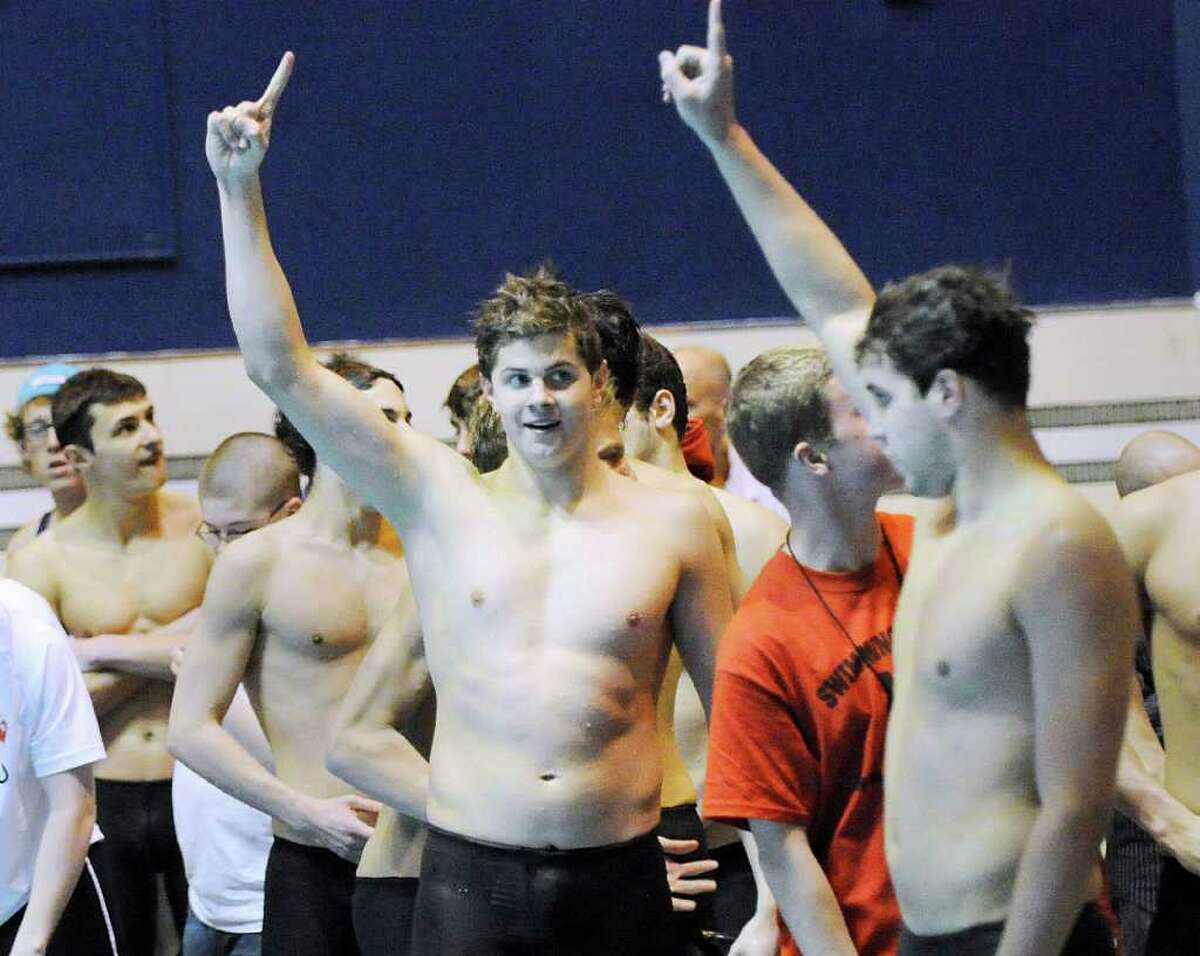 Andrew Dillinger, center, of Greenwich High School holds up the number one sign with his teammates as GHS won the State Open Swimming Championships at Yale University, New Haven, Conn., Saturday afternoon, March 19, 2011.