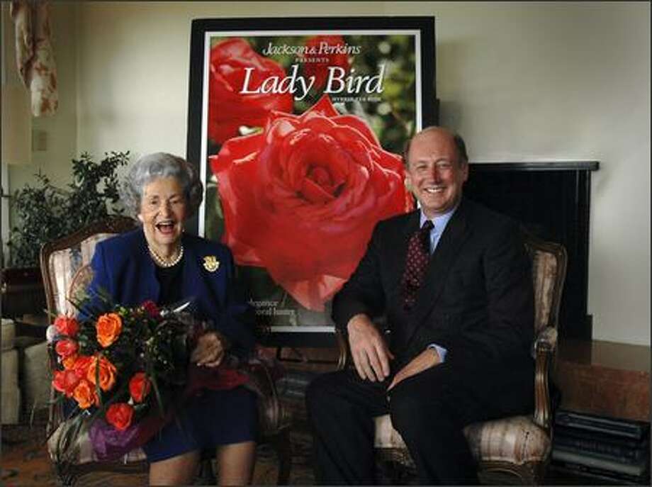 The oldest living first lady, Lady Bird Johnson, 93, is shown in this photo provided by Jackson & Perkins receiving a bouquet of the commemorative rose named in her honor from Bill Williams, President of Jackson & Perkins Tuesday, Oct. 24, 2006, at her home in Austin, Texas. Ten percent of the net proceeds from the sale of each hybrid tea rose bush will be donated to the Lady Bird Johnson Wildflower Center in Austin, Texas. Johnson, is the widow of President Lyndon B. Johnson. The rose is launched as part of the First Ladies Rose Series and it joins roses named for first ladies Nancy Reagan, Barbara Bush and most recently, the Laura Bush Rose. Photo: / Associated Press