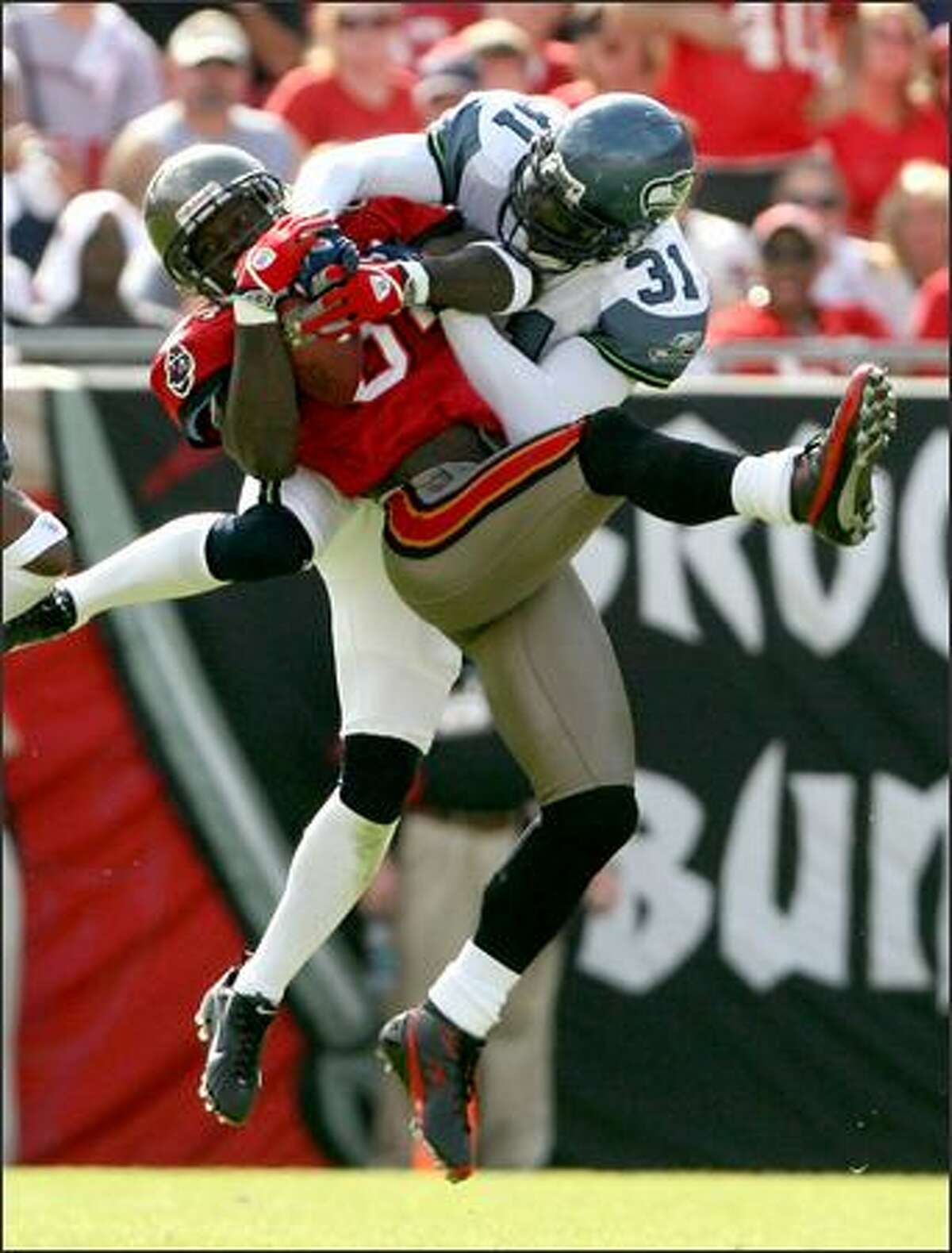 Kelly Herndon had tight coverage, but former Seahawk and current Buccaneer Joey Galloway was able go haul in this 44-yard pass in the first quarter.