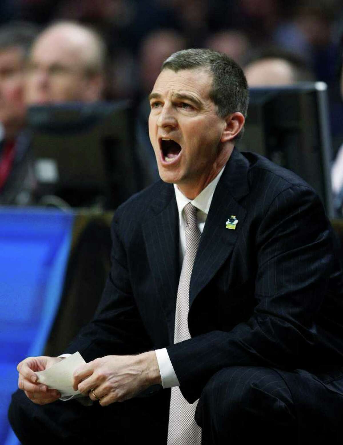 Texas A&M head coach Mark Turgeon yells out to his team in the first half of a second-round NCAA Southwest Regional tournament college basketball game in Chicago, Friday, March 18, 2011. Florida State won 57-50.