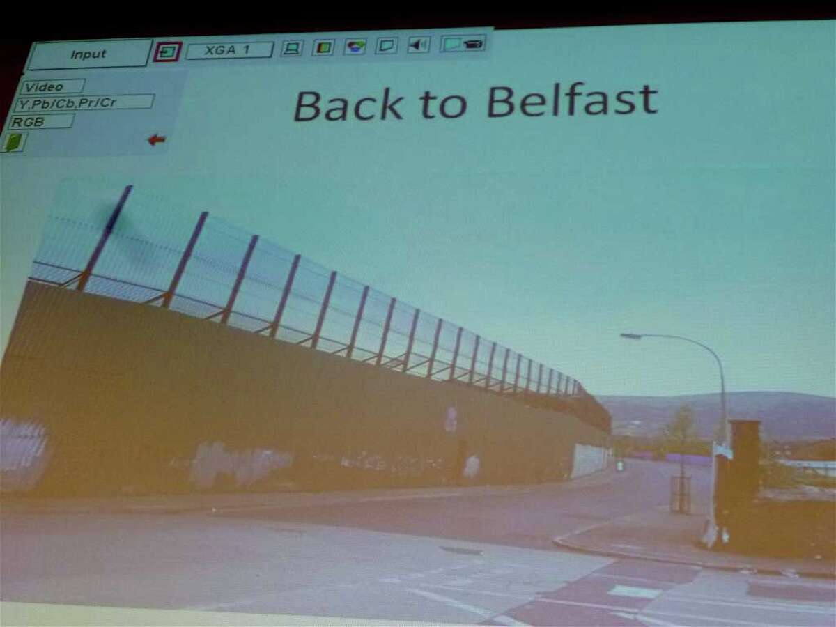 A 50-foot wall separates a Catholic high school from a Protestant high school in Belfast, Northern Ireland. The slide was part of Michael Evans' lecture on Full Court Peace, the non-profit he founded that uses basketball as a diplomacy tool in places like Belfast.