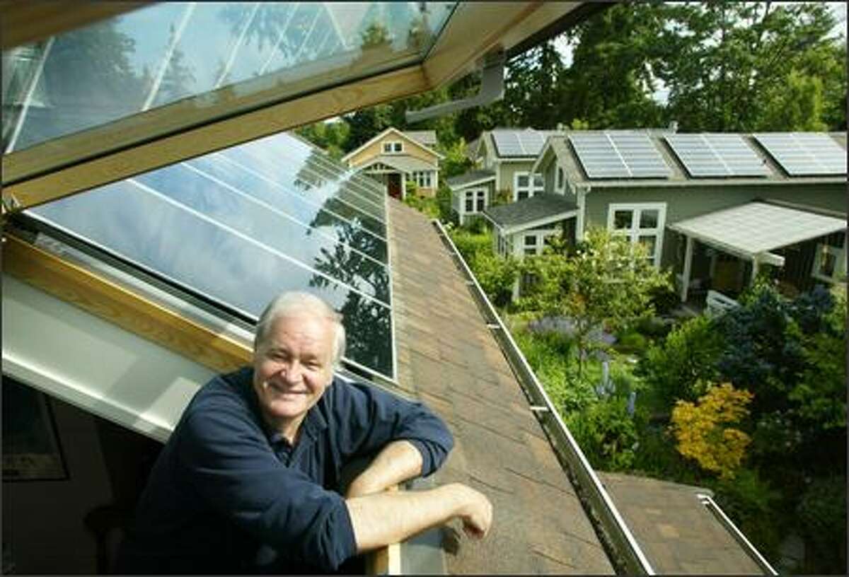 Mike Nelson's home in Shoreline is powered by solar arrays on the roof, accessed by a skylight. Two of his neighbors recently installed solar energy systems as well. His home uses just 3.5 kilowatt-hours a day; the Seattle average is 30.