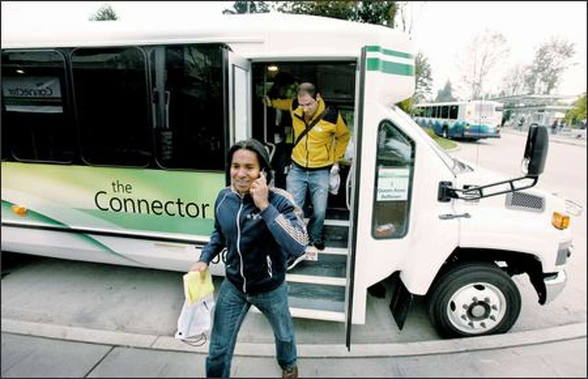 Software engineer Jaspreet Bakshi arrives at the Overlake Transit Center at Microsoft's Redmond campus Monday, the first day of service for the new bus line.