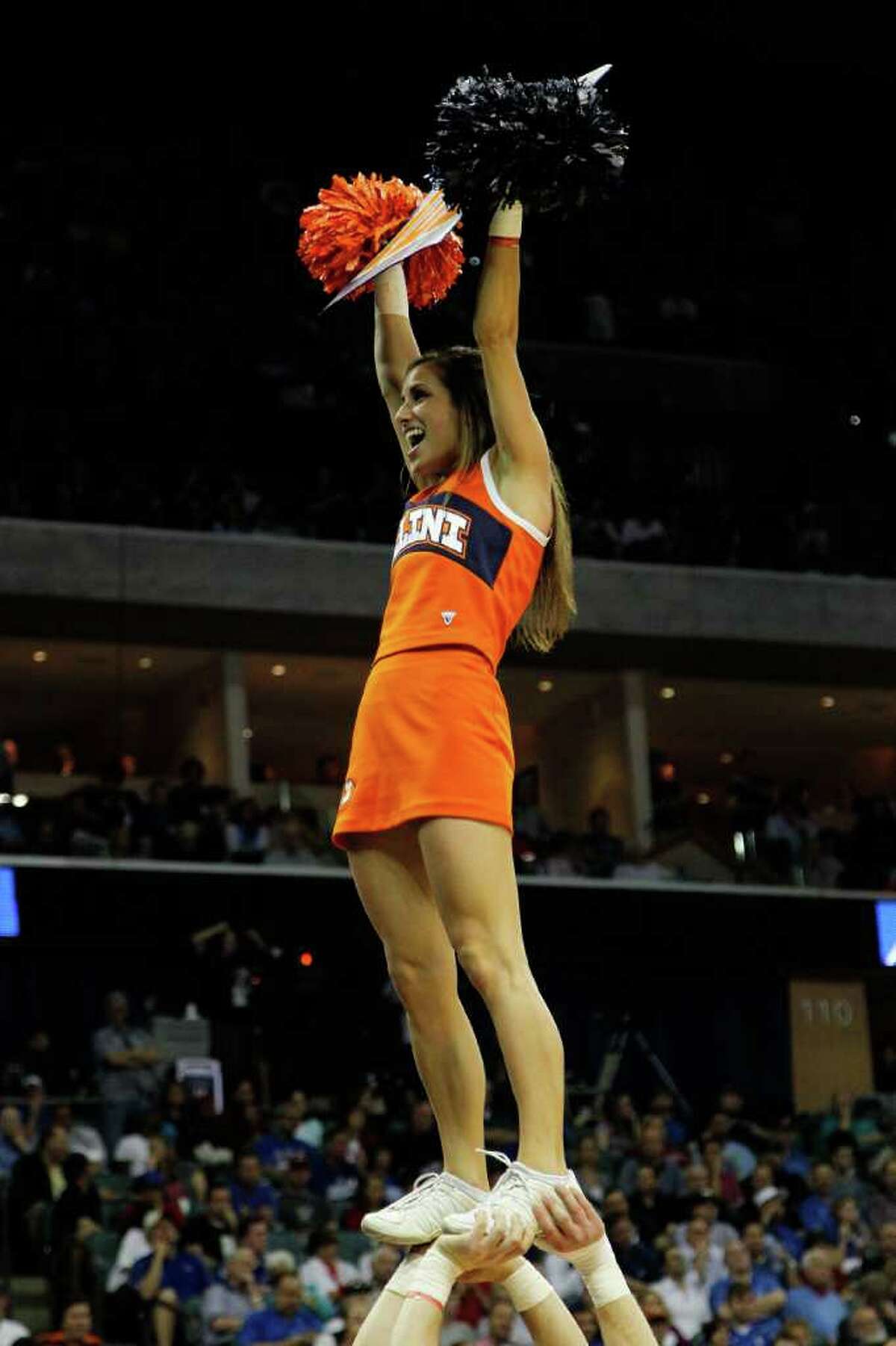 TULSA, OK - MARCH 20: Cheerleaders for the Illinois Fighting Illini perform during the third round game against the Kansas Jayhawks in the 2011 NCAA men's basketball tournament at BOK Center on March 20, 2011 in Tulsa, Oklahoma. (Photo by Tom Pennington/Getty Images)