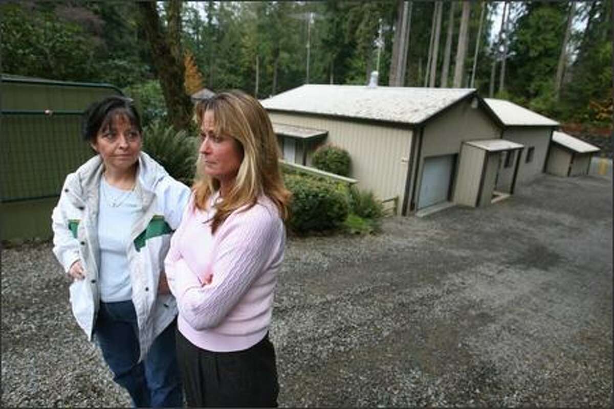 Sisters Danel Swan, right, and Debra Phelps used to attend The Church, in the background at the complex in Port Orchard, which was led by Robbin Leeroy Harper, who has been accused by five young women of sexual abuse. Swan and Phelps' 20-year-old niece was the first to make a report to police. Harper had been molesting her since age 12, the young woman said.