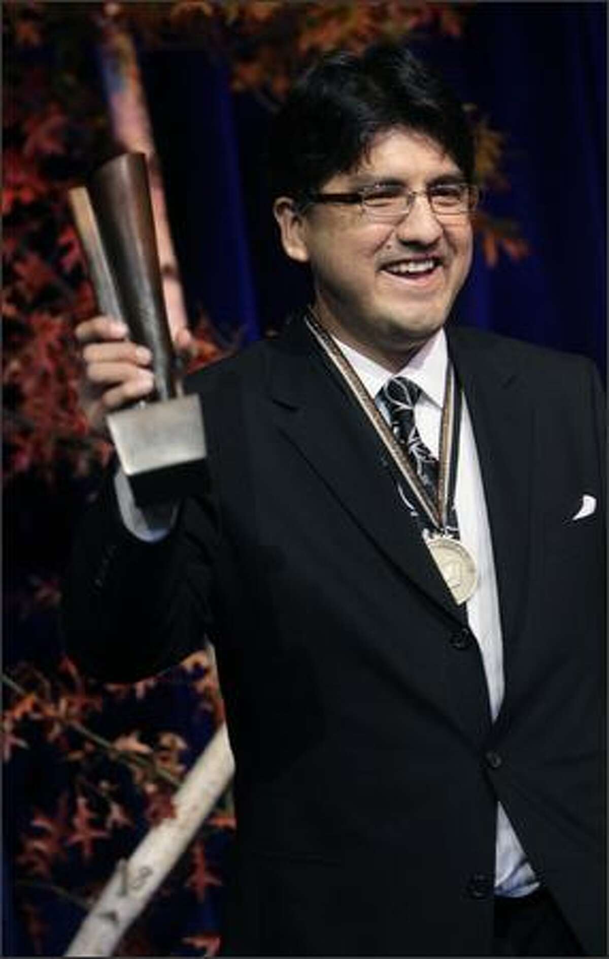 Sherman Alexie accepts the National Book Award for Young People's Literature for his book "The Absolutely True Diary of a Part-Time Indian" at the 58th National Book Awards in New York.