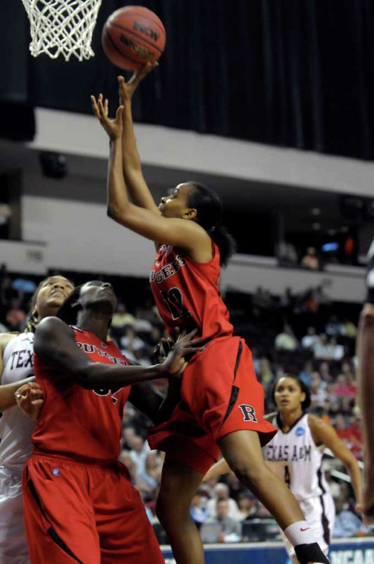 Rutgers guard Daisha Simmons (12) shoots over the Texas A&M defense during the first half of a second-round game of the NCAA women's college basketball tournament, Tuesday, March 22, 2011, in Shreveport, La.