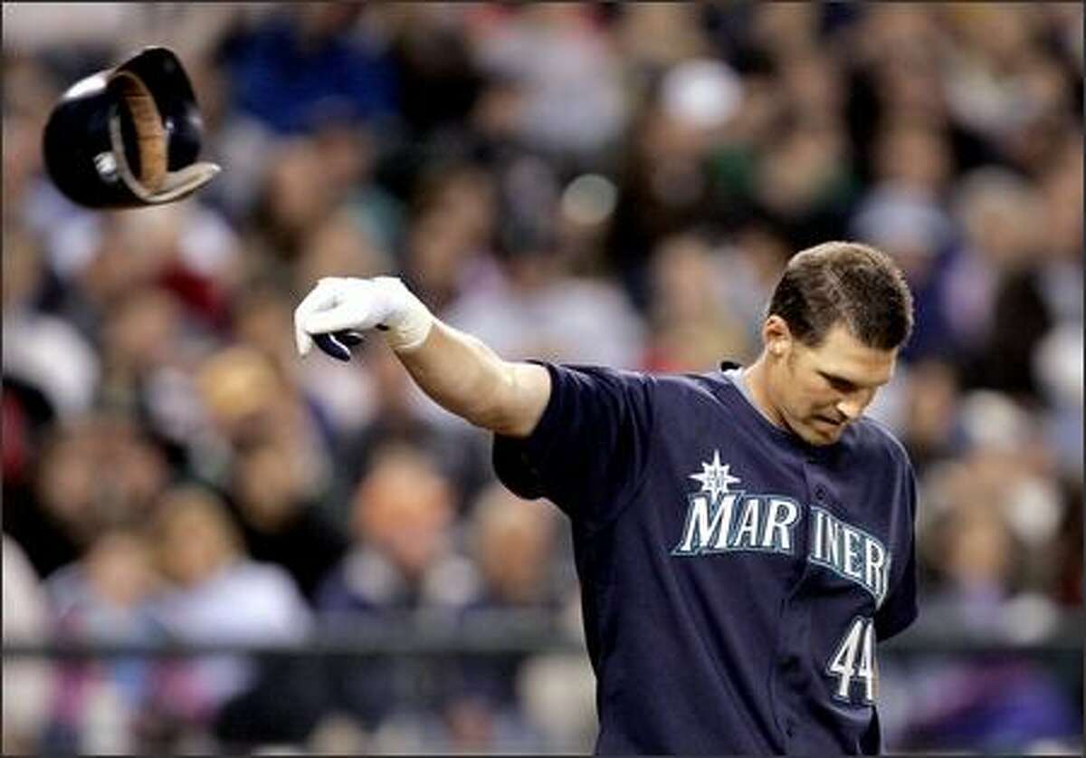 Seattle Mariners' Richie Sexson, right, is greeted at home by Adrian Beltre  following Sexson's seventh inning home run against the Oakland Athletics  during opening day at a baseball game, Monday, April 2