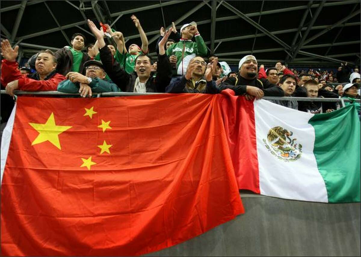 Fans of the Chinese and Mexican national teams root for their teams during a soccer match between Mexico and China at Qwest Field.
