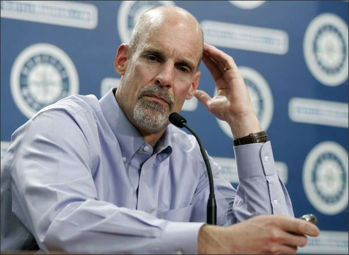 Bill Bavasi ponders a question at a news conference Monday. Bavasi was fired earlier in the day as the Seattle Mariners general manager. Vice president/associate general manager Lee Pelekoudas will take over in his place.