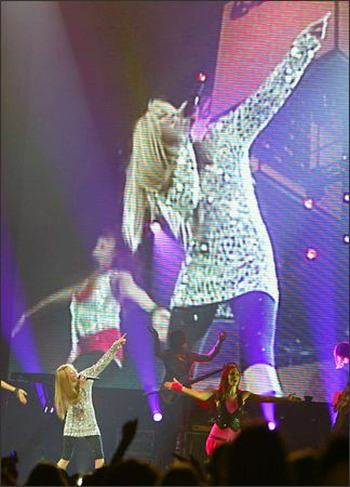 Miley Cyrus aka Hannah Montana performs during her concert at Key Arena.