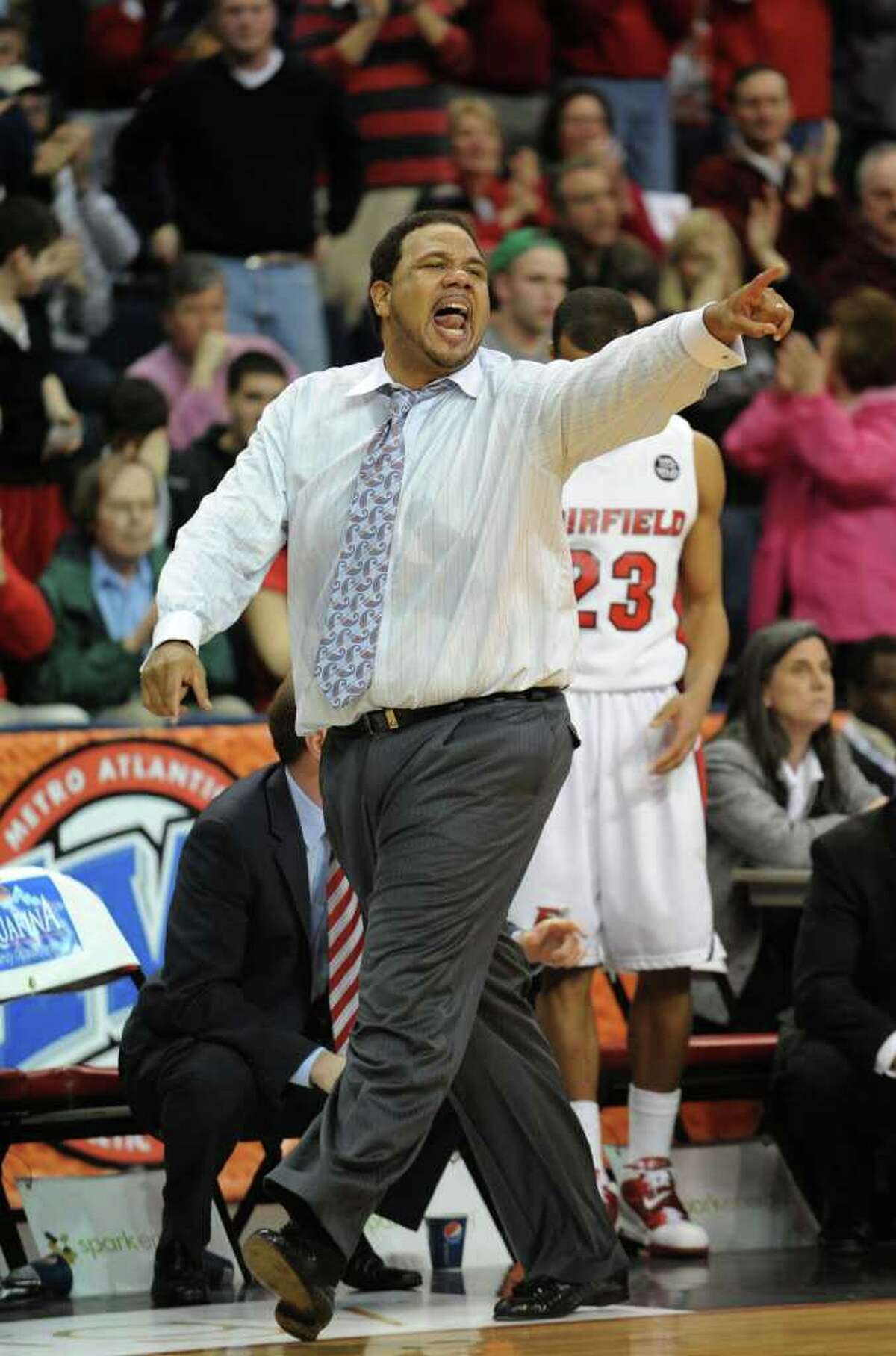 This photo made March 13, 2011 shows Fairfield University head coach Ed Cooley shouting instructions to his players during the MAAC men's basketball tournament in Bridgeport, Conn. Providence has hired former Cooley to replace the fired Keno Davis. (AP Photo/Connecticut Post, Brian A Pounds) ** MANDATORY CREDIT **