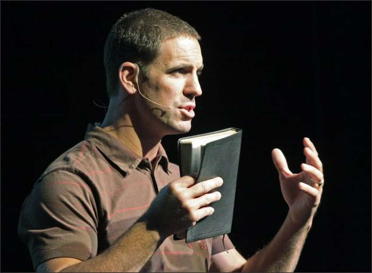 Pastor Jesse Winkler leads a service at the new Mars Hill Church in Bellevue on Sunday.