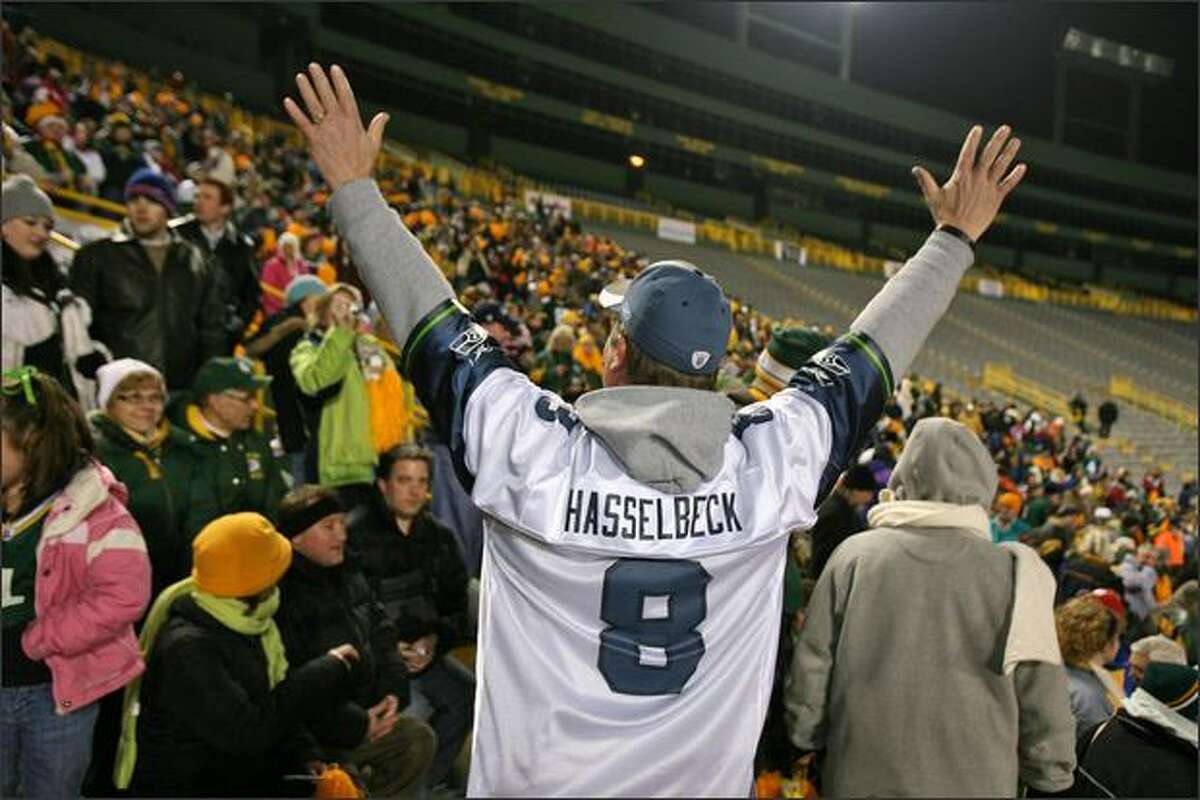 A daring Glen Kanenwisher, a Boeing manager from Seattle, introduces himself to the crowd wearing a Matt Hasselbeck jersey during a Packers pep rally at Lambeau Filed in Green Bay, Wisconsin.