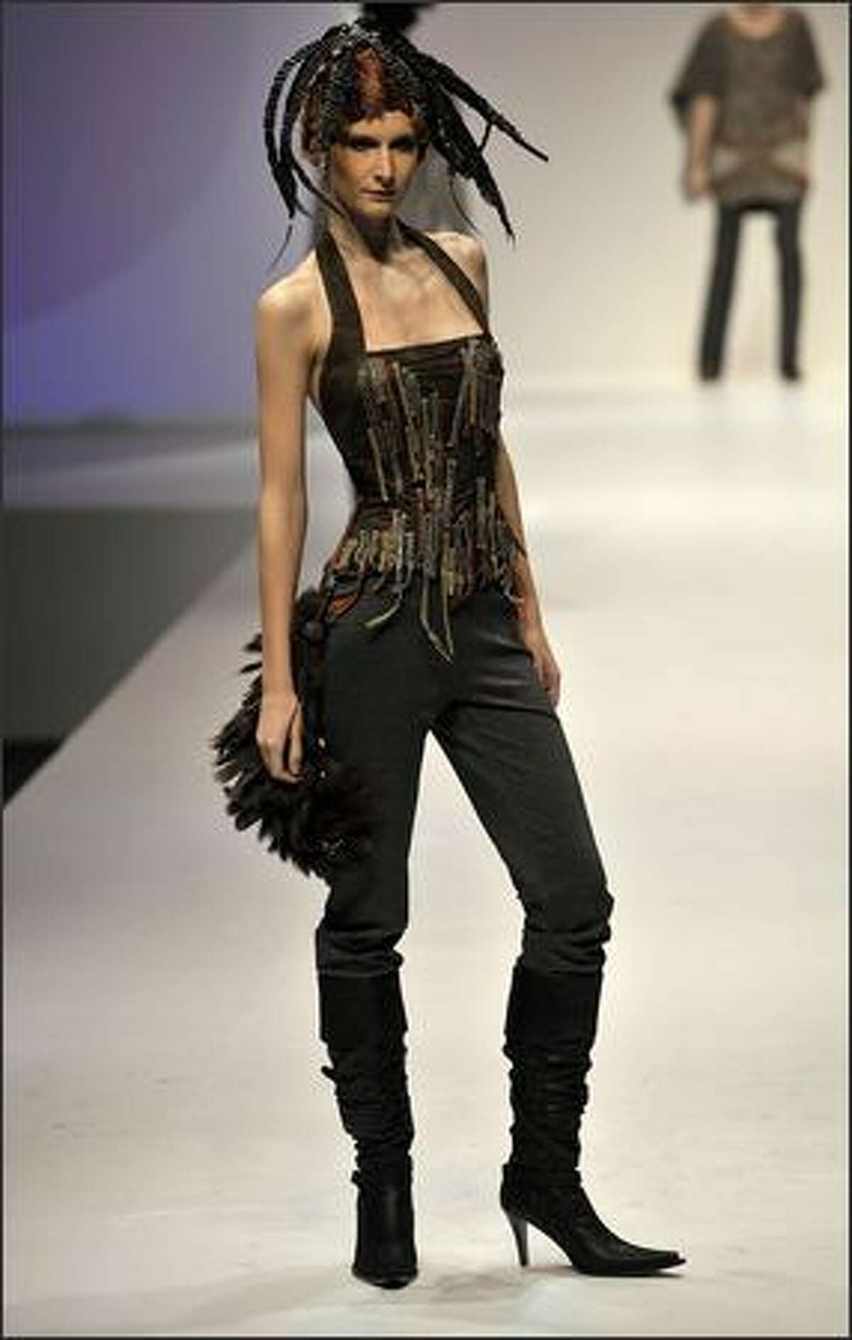 A model showcases designs on the catwalk by Ika on the second day of Hong Kong Fashion Week Autumn/Winter 2008, at Hong Kong Convention & Exhibition Centre (HKCEC) on Tuesday in Hong Kong, China.